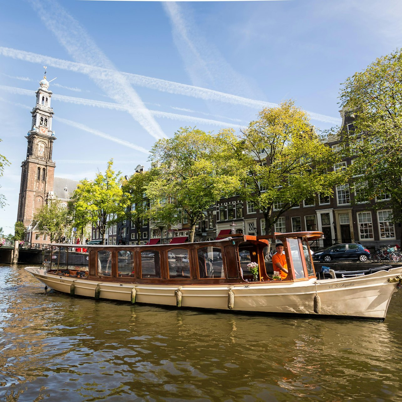 Experience a charming 60-minute cruise through Amsterdam's picturesque canals where insightful commentary brings the city's rich history and local culture to life all in cozy comfort.