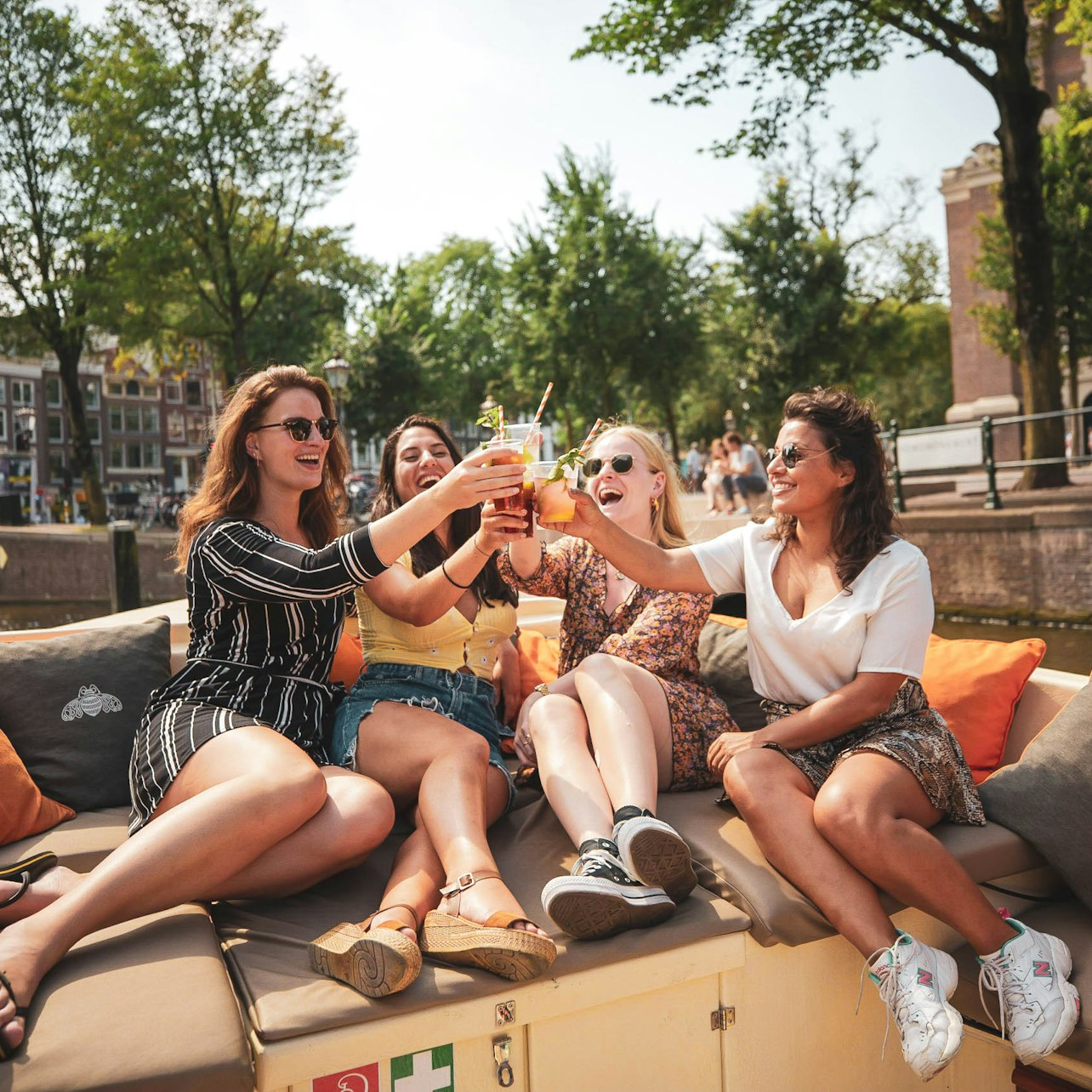Savor the charm of Amsterdam's canals with friends while enjoying delicious drinks. Cruise past iconic sights and soak in the scenic beauty of the city’s waterways.