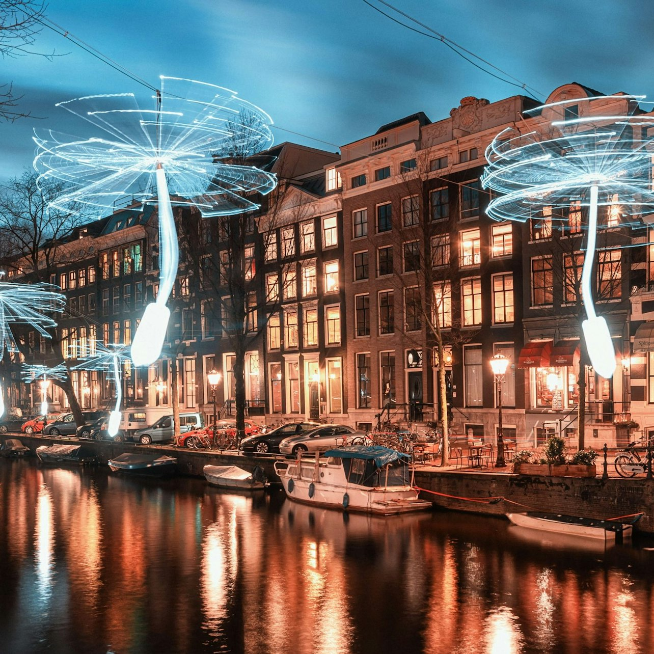 Experience Amsterdam’s charm as you glide through its illuminated canals enjoying hot Glühwein or chocolate while viewing stunning light displays and iconic city landmarks.