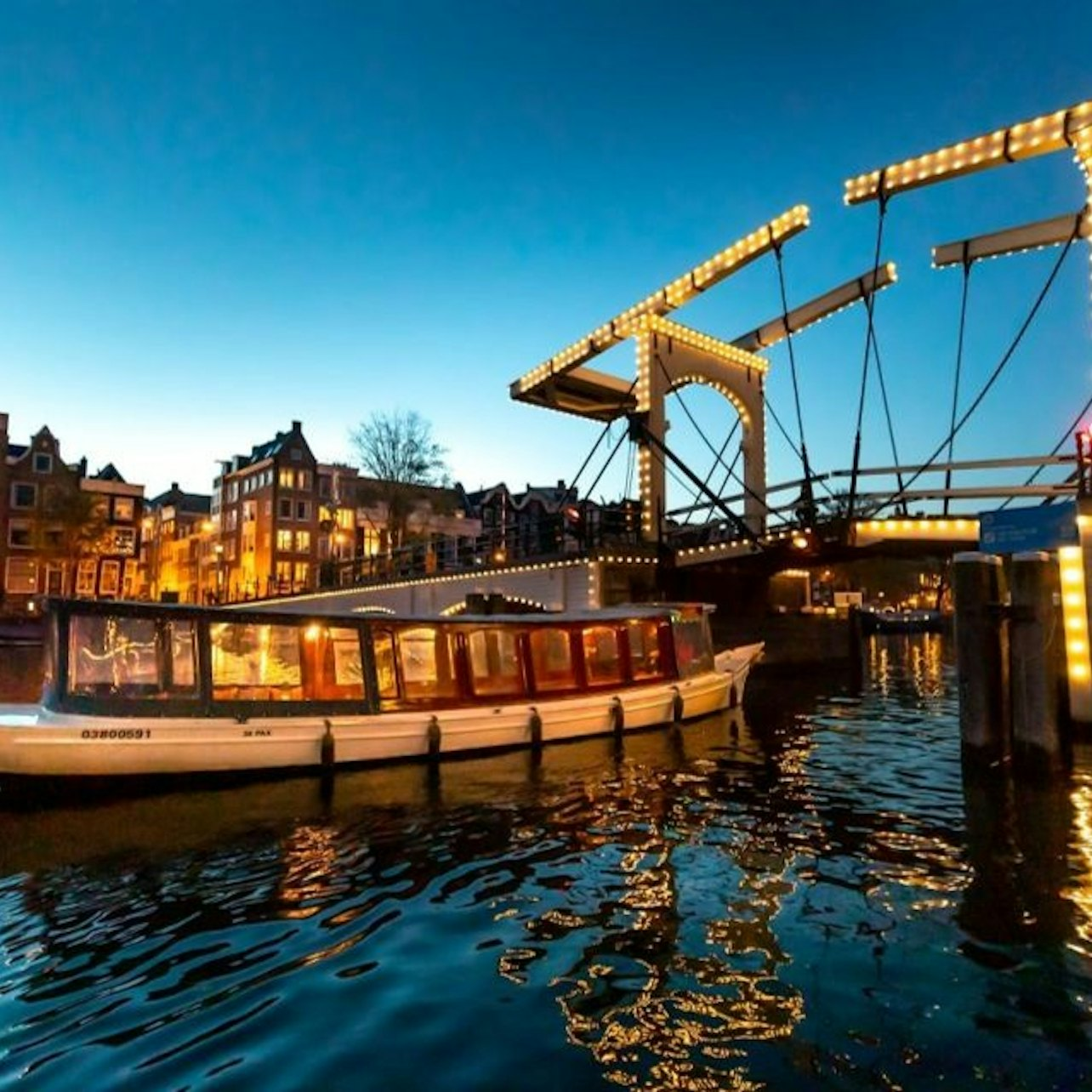 Amsterdam Light Festival: Saloon Boat Cruise + Optional Unlimited Drinks - Photo 1 of 5