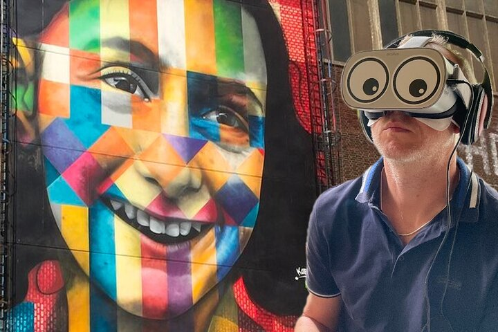 Immerse yourself in Anne Frank’s world through virtual reality exploring her hiding place and experiencing her journey all while surrounded by the vibrant mural that honors her legacy.