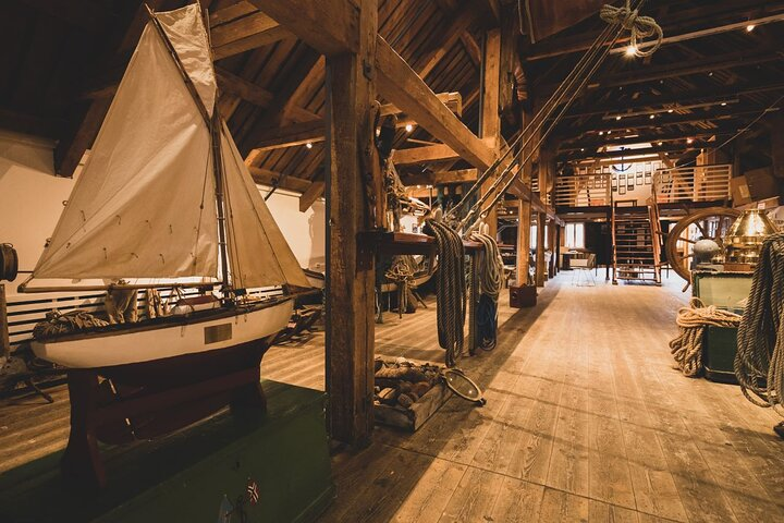 Step into a historic warehouse filled with maritime treasures showcasing Arctic life through engaging exhibits and artifacts. A delightful journey into Tromsø's rich coastal heritage awaits.