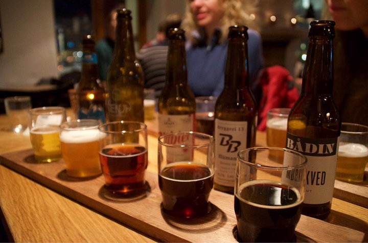 Explore Tromsø’s unique beer culture while sampling a diverse selection of locally crafted brews paired with Arctic tapas all amidst the charm of its historic pubs and lively ambiance.