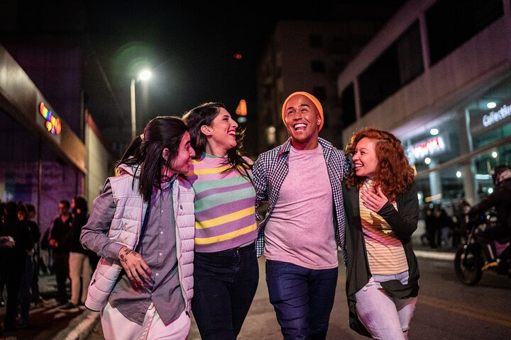 Explore Tromso's haunted corners with friends sharing laughter while uncovering eerie stories and mysteries all under the dim glow of city lights and ghostly whispers.