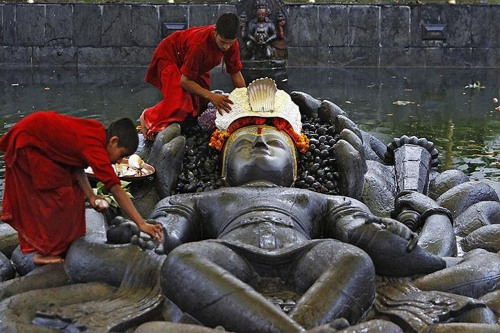 Lord Vishnu being ornamented for performing Puja