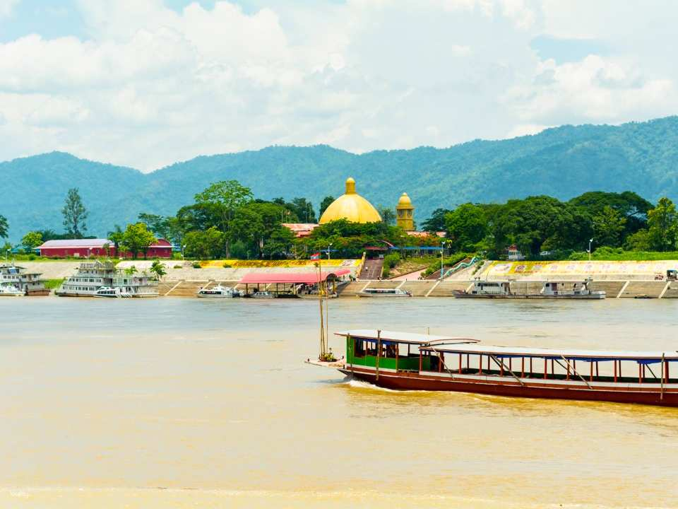 Chiang Rai Day Tour: White & Blue Temples, Black House, Hot Spring, Golden Triangle Boat Ride & Long Neck Village - Photo 1 of 6