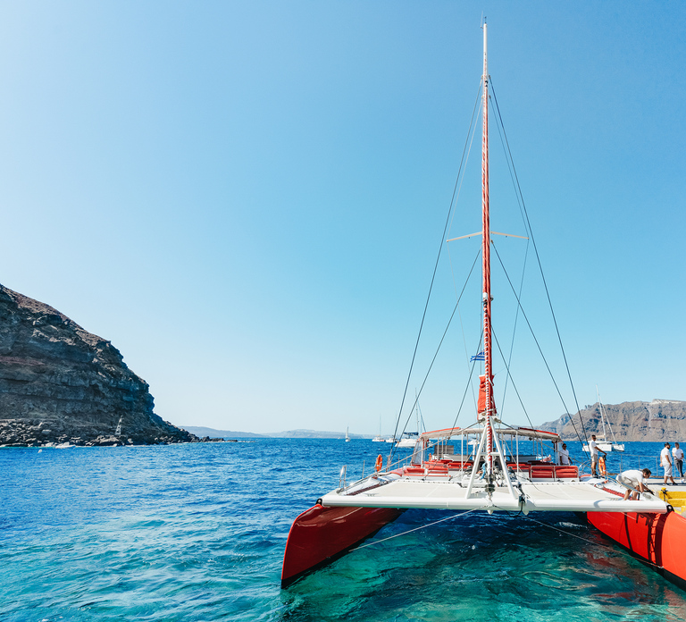 Santorini: Catamaran Tour with BBQ Dinner, Drinks, and Music - Photo 1 of 10