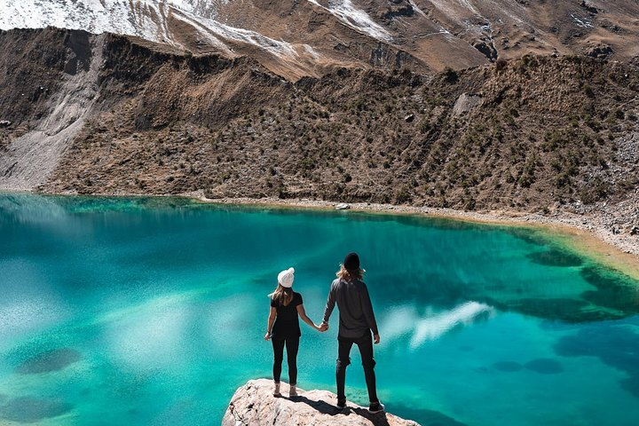 Couple is enjoying the view on the impressive lake