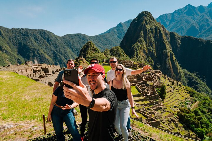Incredible views with small groups in Machu Picchu, guided by our expert taking photos.