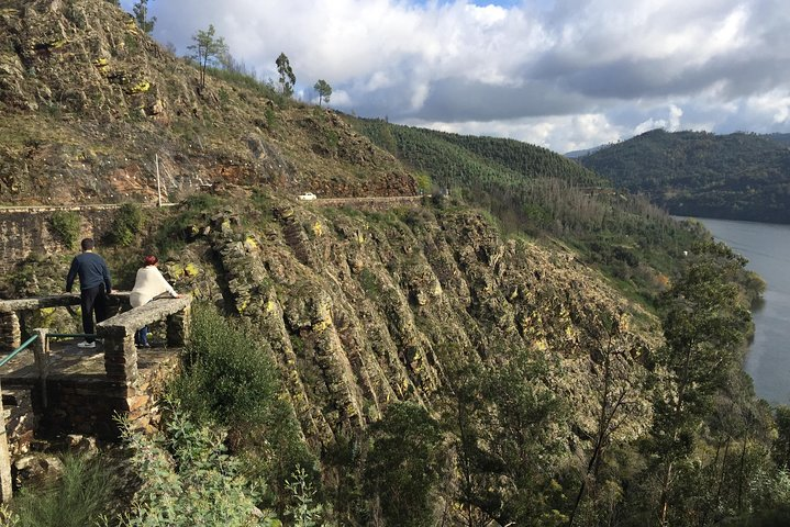 Explore the stunning Douro Valley from a classic Jeep uncovering scenic landscapes and picturesque farms while capturing memorable moments along the iconic 222 national road.