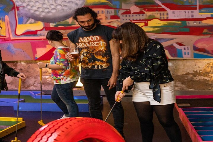 Experience mini golf like never before with an 18-hole course featuring twists turns and a fun backdrop. Enjoy friendly competition or unwind at the stylish bar area. Perfect for all ages!