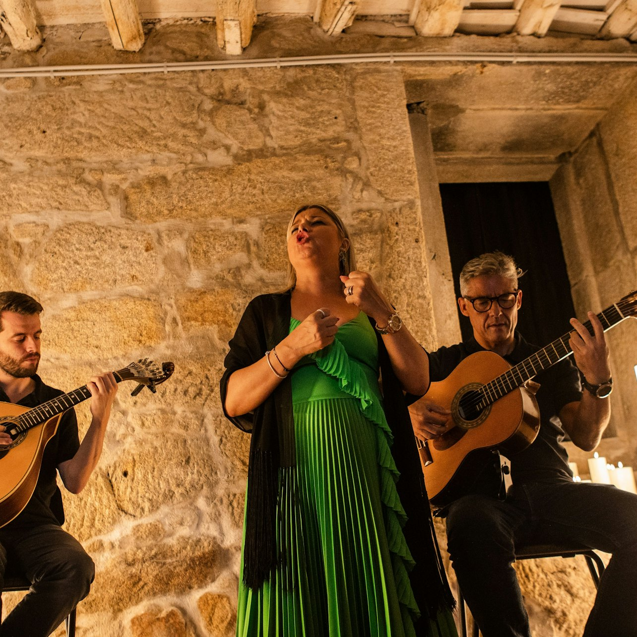 Experience the soulful sounds of fado as talented musicians perform in a historic setting surrounded by the charm of Porto's ancient architecture and scenic views.
