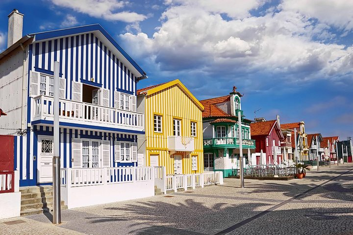 Explore the charming colorful houses of Costa Nova where the coast meets culture. Enjoy a relaxing stroll and soak in the delightful scenery that embodies Portugal's unique heritage.