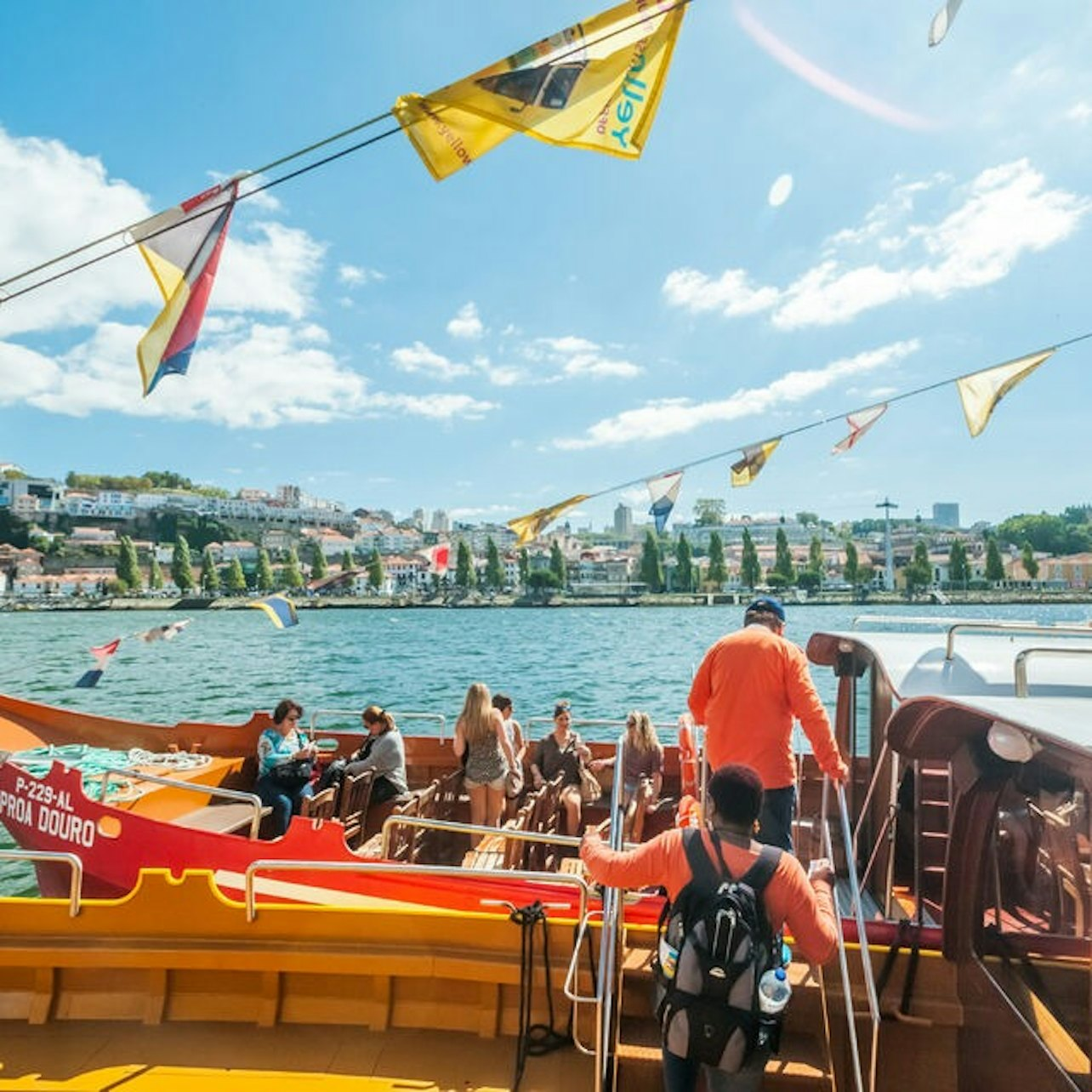 Experience the charm of Porto as you glide along the Douro River savoring stunning views of historic bridges and the picturesque skyline of Vila Nova de Gaia.