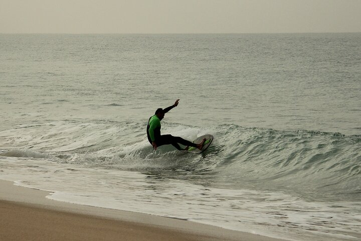 Experience the joy of skimboarding on stunning Costa da Caparica beaches where expert guidance meets the ocean's embrace helping you hone your skills and confidence on the waves.