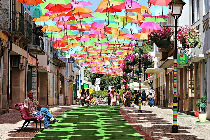 Beneath a canopy of colorful umbrellas stroll through Águeda’s charming streets where art meets tradition. Enjoy local culture unique shops and a delightful lunch that enhances this picturesque experience.