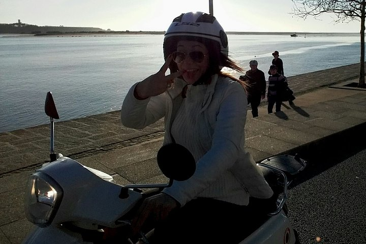 Explore the charming streets of Porto on a 50cc scooter. Experience the freedom to discover iconic landmarks and scenic views at your own pace. Enjoy the ride!