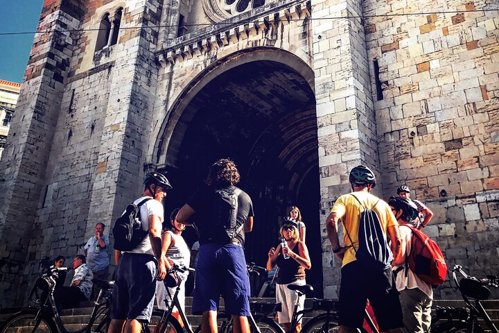Experience the unique charm of Lisbon as you bike through its historic streets stopping to admire stunning architecture and connect with fellow adventurers amidst the city’s rich culture.