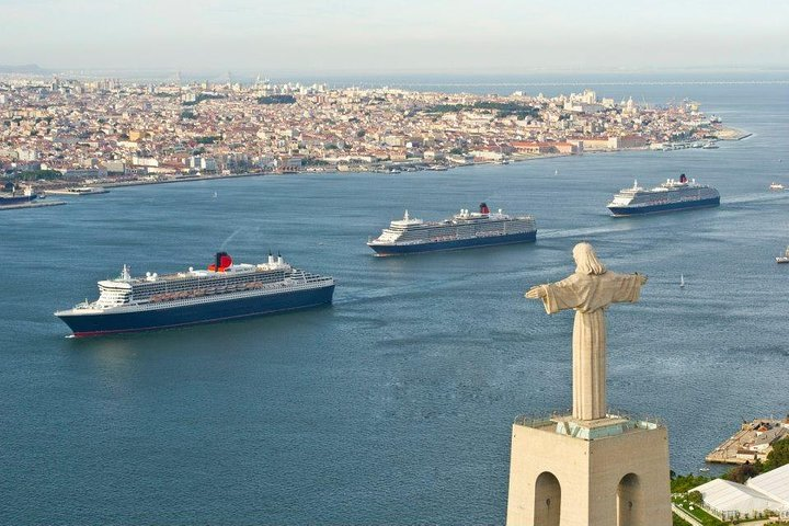 Tagus River and the city of Lisbon blessed by Christ the King and blessing the ships Queen Elisabeth, Queen Victoria and Queen Mary 2.