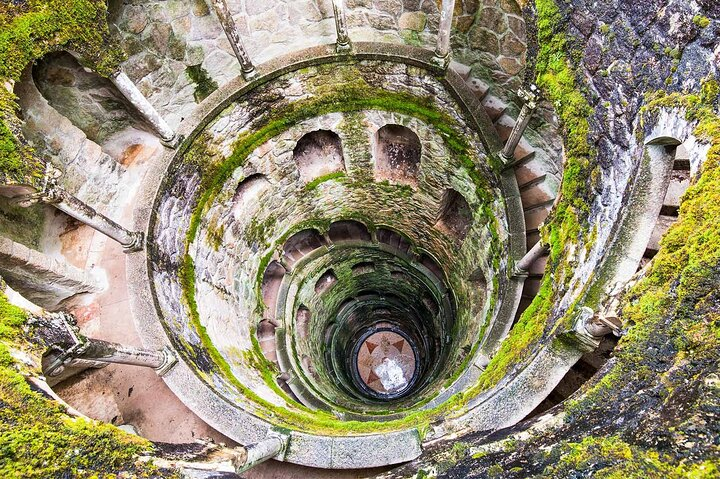 Explore the spiral depths of Sintra's mystical well a testament to medieval architecture. Discover the unique beauty of this UNESCO World Heritage site during your adventure in Portugal.
