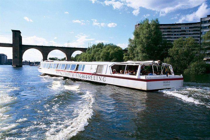 Glide along Stockholm's scenic waterways passing under striking bridges and revealing picturesque island views making for an unforgettable exploration of this stunning city.