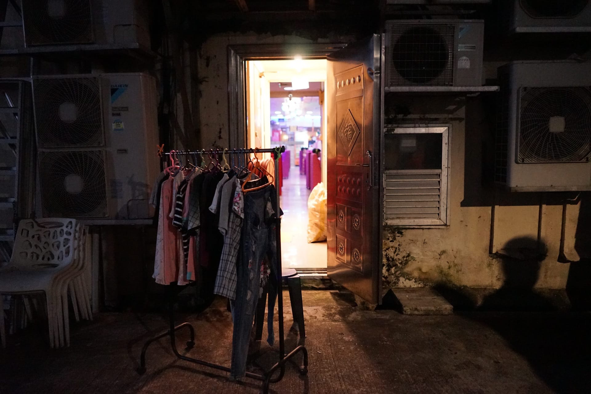 Explore Geylang's hidden gems where shadows meet colorful shopfronts revealing stories of diverse lives and cultures that thrive in this unique corner of Singapore.