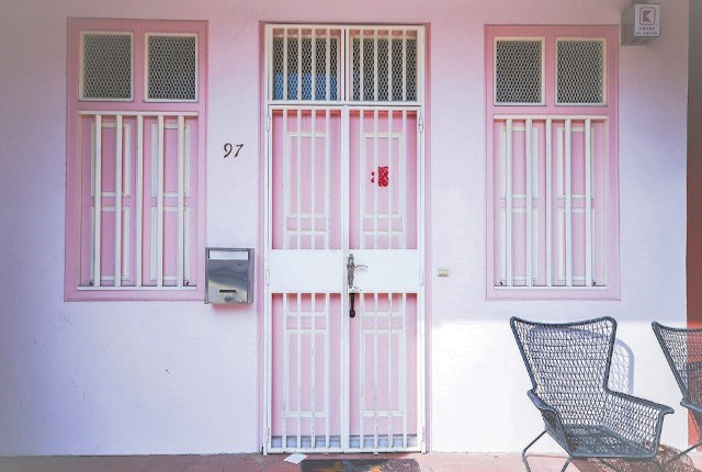 Experience the unique charm of Joo Chiat’s pastel-colored architecture where each doorway tells a story inviting explorers to delve into the rich cultural tapestry of Singapore's heritage.