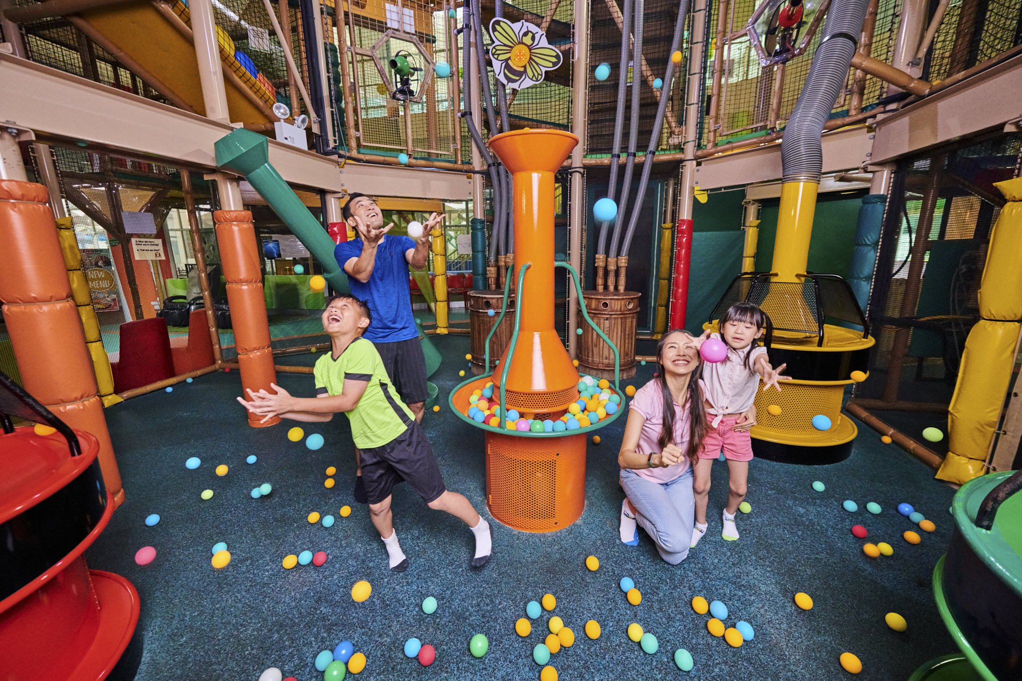 Joyful moments unfold as families engage in imaginative play filled with colorful elements and fun activities that spark creativity and enhance coordination skills for kids of all ages.