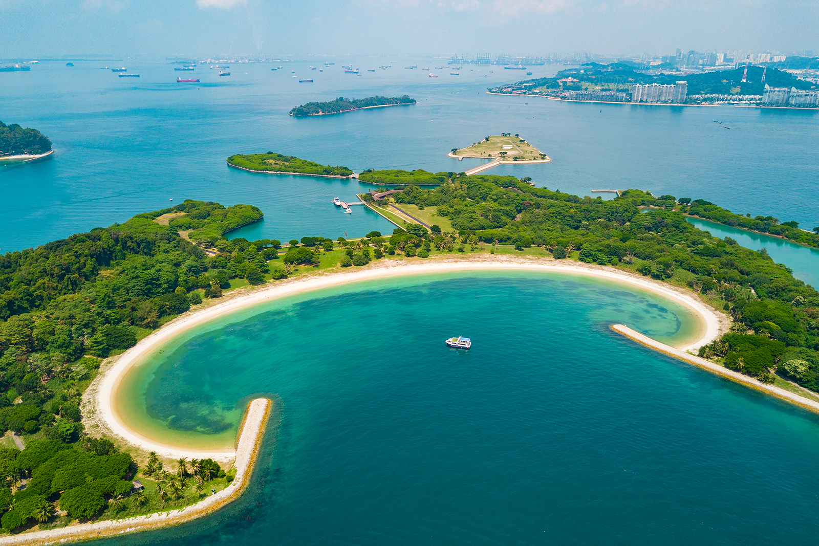 Escape to Singapore's serene southern islands where soft sands and turquoise waters invite relaxation and exploration. Discover hidden treasures and create lasting memories amidst stunning coastal scenery.