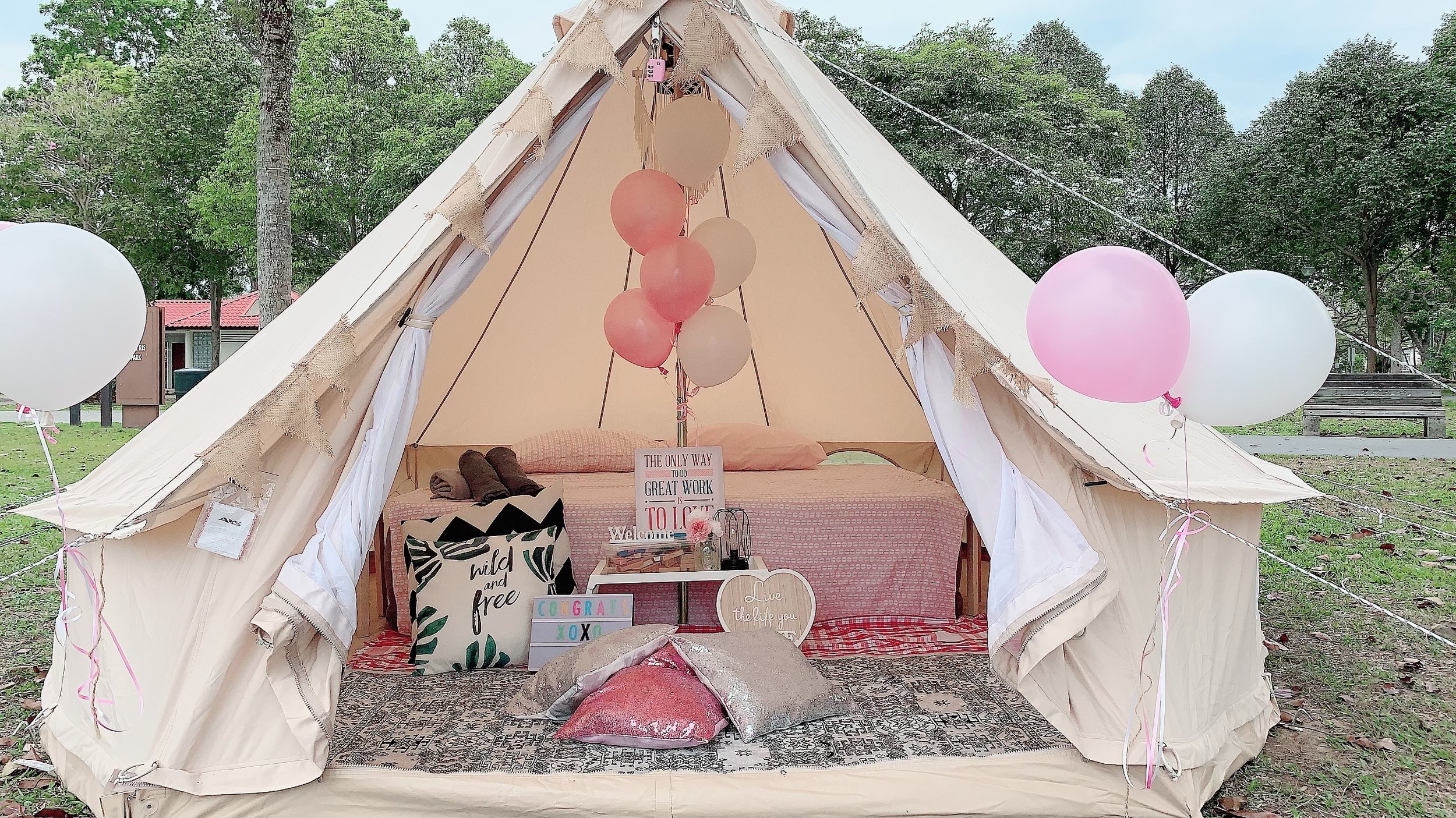 Experience luxurious camping at East Coast with a beach view cozy queen air beds and whimsical fairy lights perfect for relaxation and enjoying nature's beauty.
