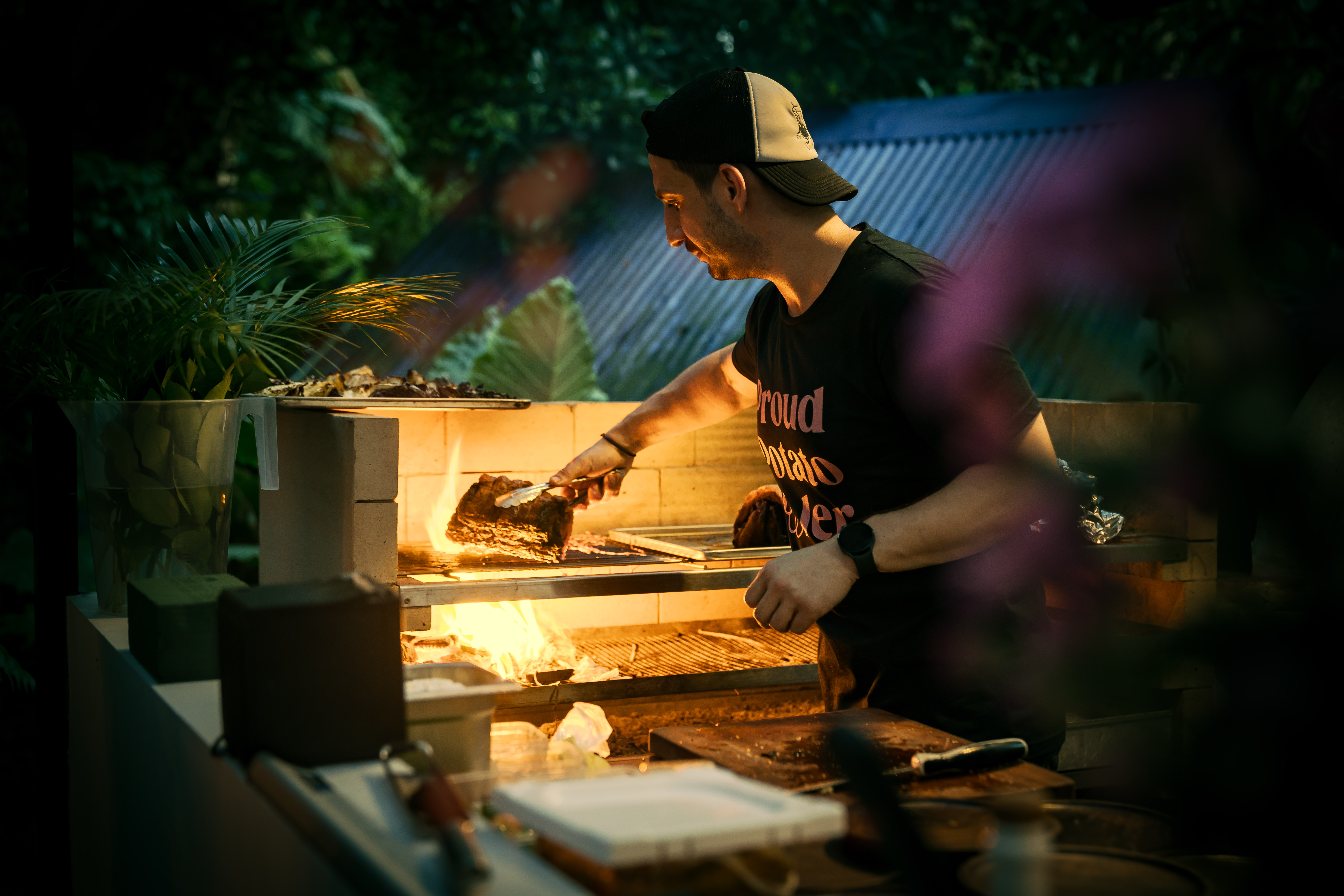 Immerse yourself in a lush culinary adventure as a skilled chef crafts exquisite dishes in a serene jungle setting perfectly paired with unique cocktails for an unforgettable dining experience.