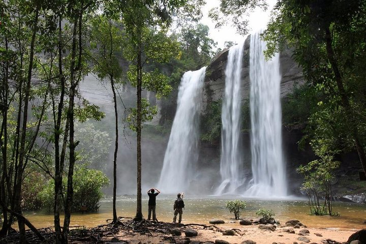 Experience the refreshing beauty of Thailand's waterfalls amidst lush greenery a perfect backdrop for adventure and relaxation on your journey through nature and culture.