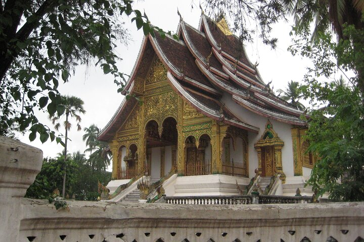 Experience the intricate architecture of Luang Prabang's temples where traditional artistry blends seamlessly with the serene landscapes inviting exploration and reflection. A perfect stop on your Southeast Asian adventure.