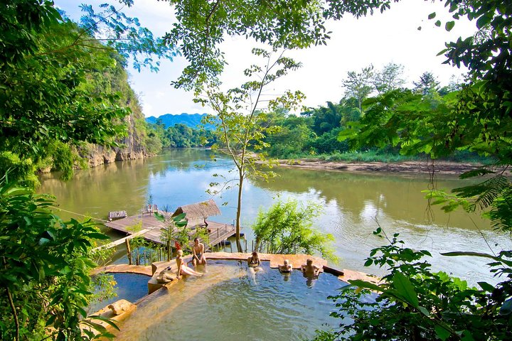 Experience a serene escape at the Kintok River Camp where lush greenery meets the tranquil waters of the Kwai River perfect for relaxation and outdoor adventure.