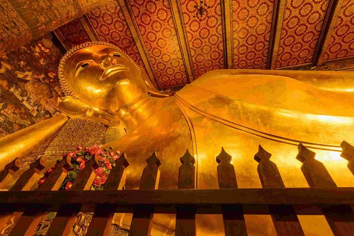 Immerse yourself in the serene beauty of Bangkok exploring iconic landmarks like the Reclining Buddha while enjoying seamless transfers and comfortable accommodations for a delightful city adventure.
