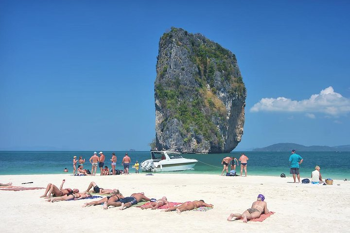 Experience the beauty of Krabi's coastline with unique limestone formations and soft sandy beaches perfect for sunbathing swimming and enjoying the underwater wonders while island hopping.