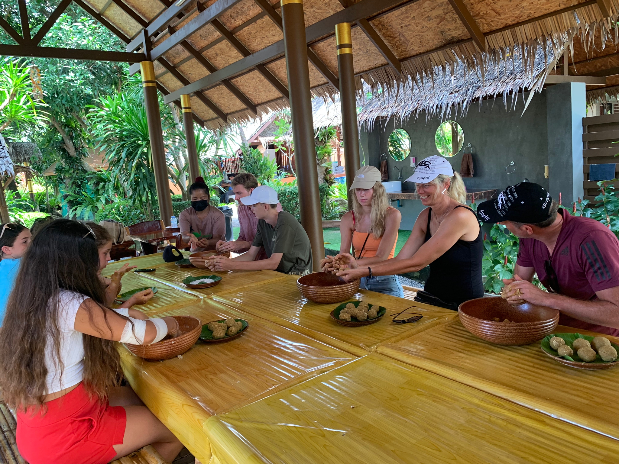 Experience the joy of authentic culinary creations surrounded by lush greenery as you connect with nature and fellow adventurers during this unique journey in Koh Samui.
