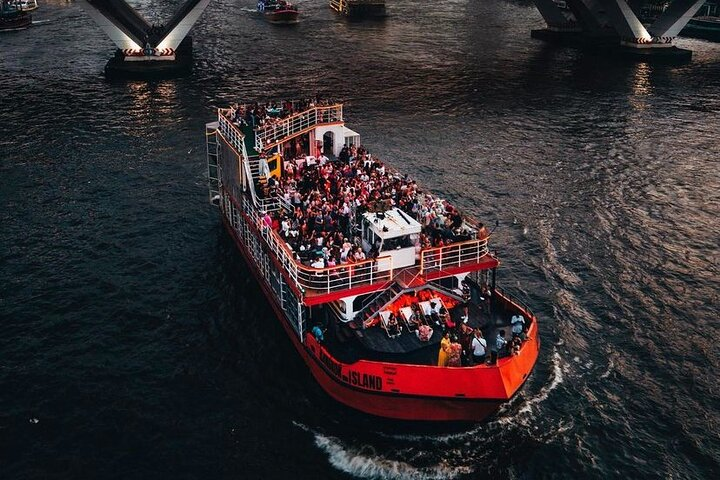 Experience the excitement of Bangkok Island with DJs dancing and breathtaking river views. Enjoy delicious food and drinks aboard a lively boat party like no other.