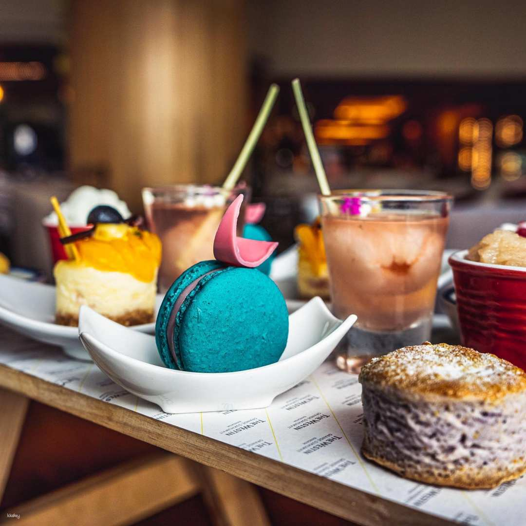 Indulge in a delightful afternoon tea experience at Zest Bar & Terrace where creative pastries and cocktails accompany stunning views of Bangkok’s skyline perfect for leisurely relaxation.