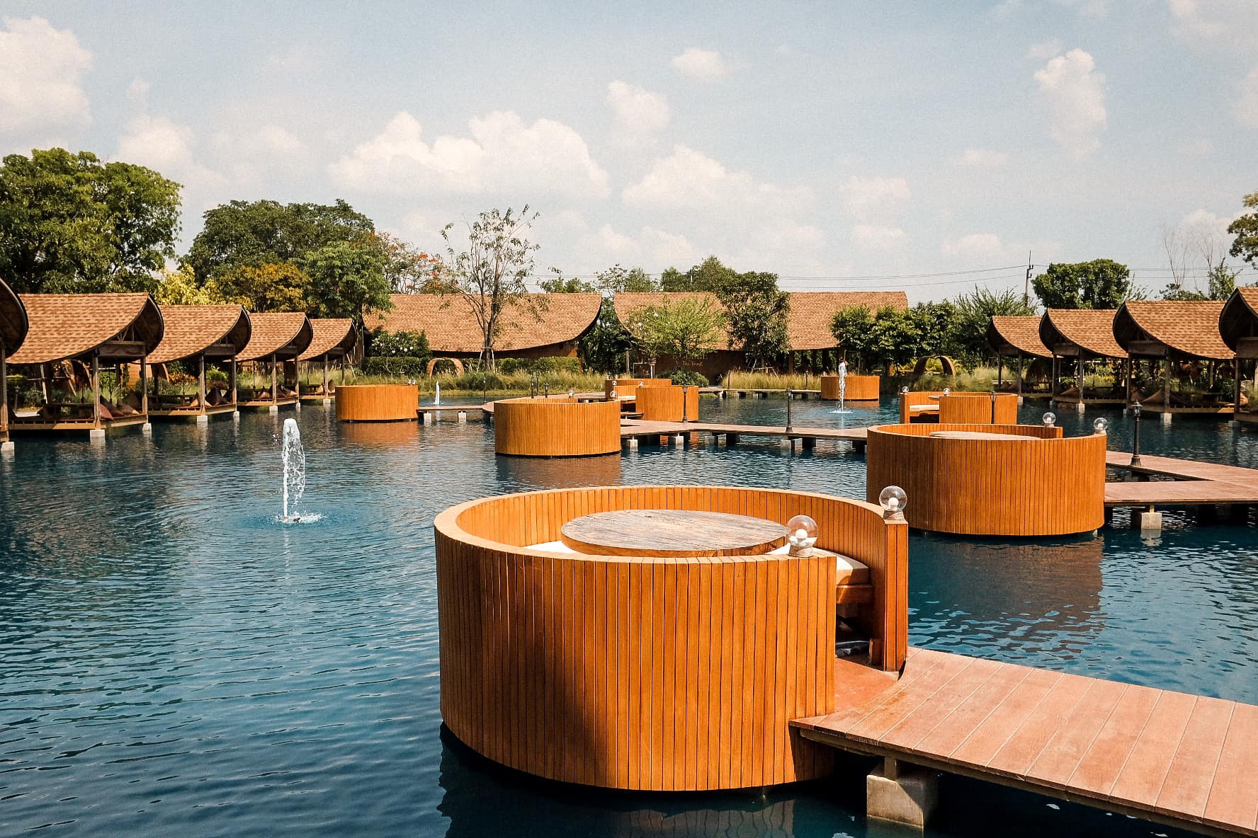 Relaxing by the water this unique café experience in Nakorn Pathom invites travelers to sip and savor while enjoying scenic views and peaceful surroundings making it a perfect stop for a memorable day.