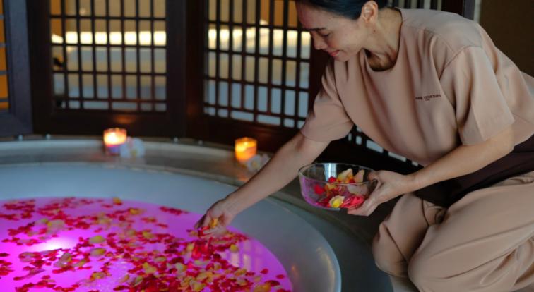 Indulge in a serene escape as skilled hands enhance your experience with fragrant petals and gentle care revealing refreshed skin and tranquil moments at Anne Semonin Spa.