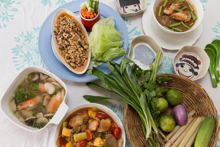 Savor a delightful array of traditional Thai dishes lovingly prepared in a local home where each bite offers a taste of Bangkok's rich culinary heritage and heartfelt hospitality.