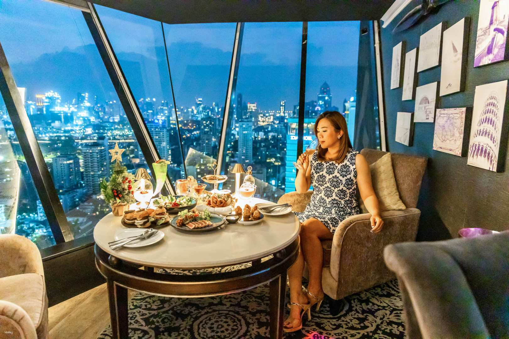 Savor exquisite drinks and gourmet bites while enjoying stunning views of Bangkok's skyline from the 38th floor at Axis & Spin Sky Lounge & Bar an unforgettable dining experience.