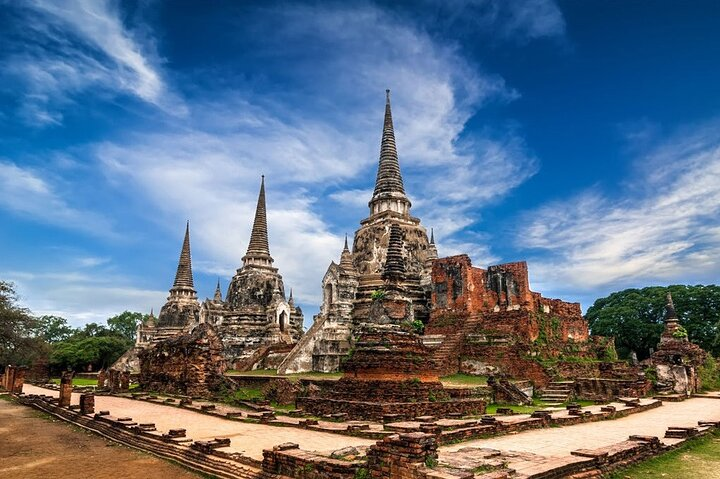 Explore the stunning ruins of Ayutthaya where ancient temples and majestic stupa towers tell stories of a glorious past while you journey through history along the Chao Phraya River.
