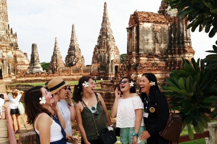 Discover the rich history of Ayutthaya as you stroll among stunning temple ruins creating unforgettable memories with friends amidst the breathtaking scenery and cultural heritage of Thailand's ancient capital.