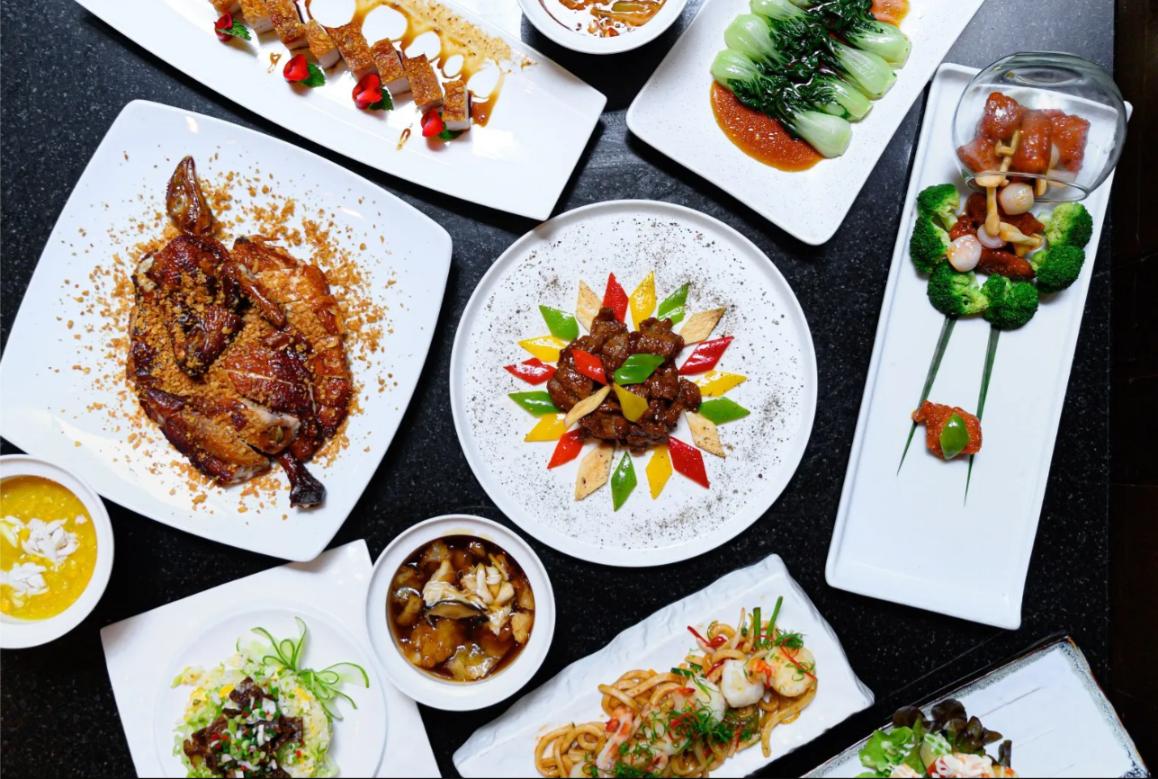 Elevate your dining experience at Bai Yun where modern Cantonese delicacies meet stunning skyline views creating a lovely backdrop for a memorable meal in Bangkok.