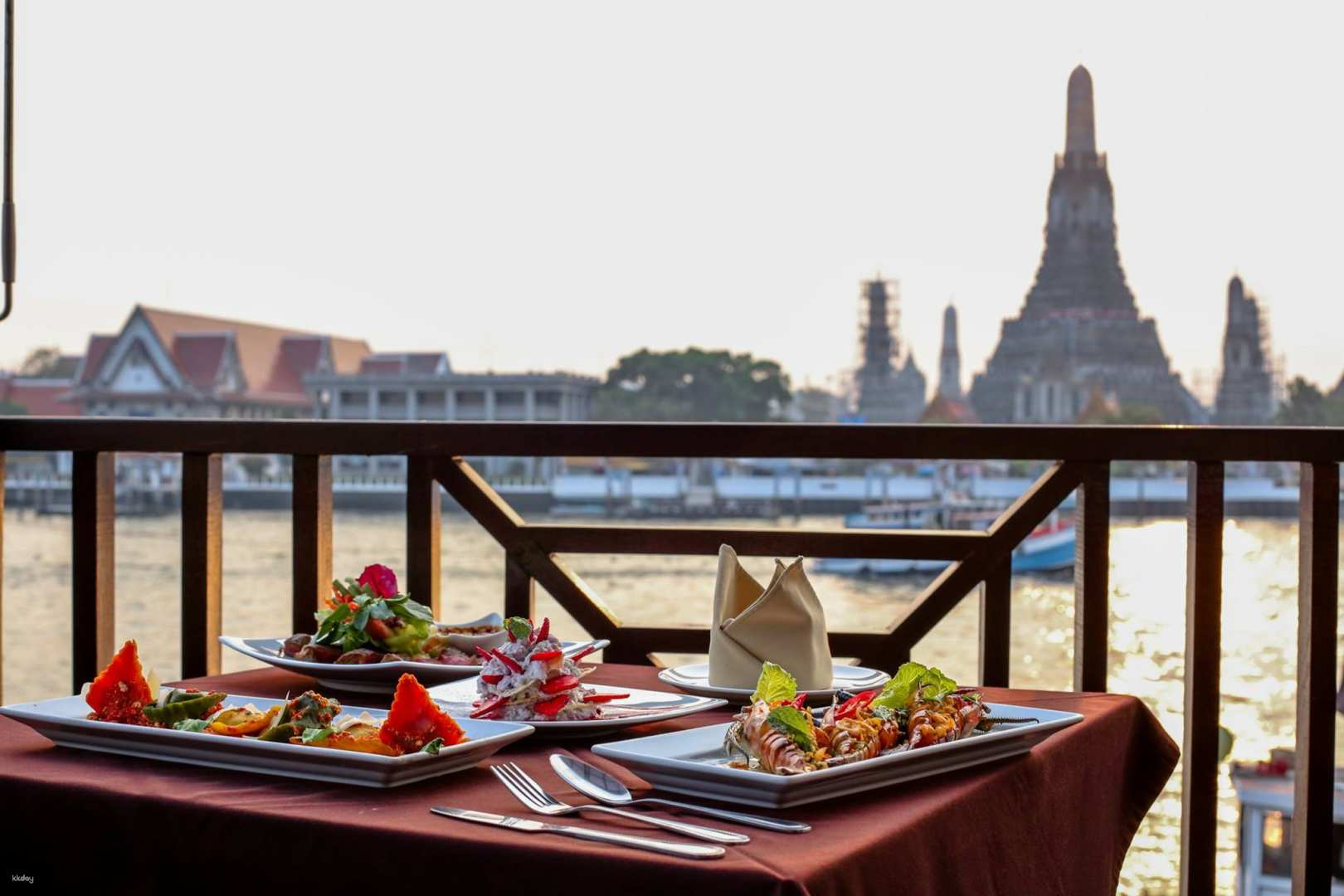 Delectable dishes await with stunning views of Wat Arun making each meal at The Deck Restaurant a delightful experience in Bangkok. Savor exquisite flavors beside the Chao Phraya River.