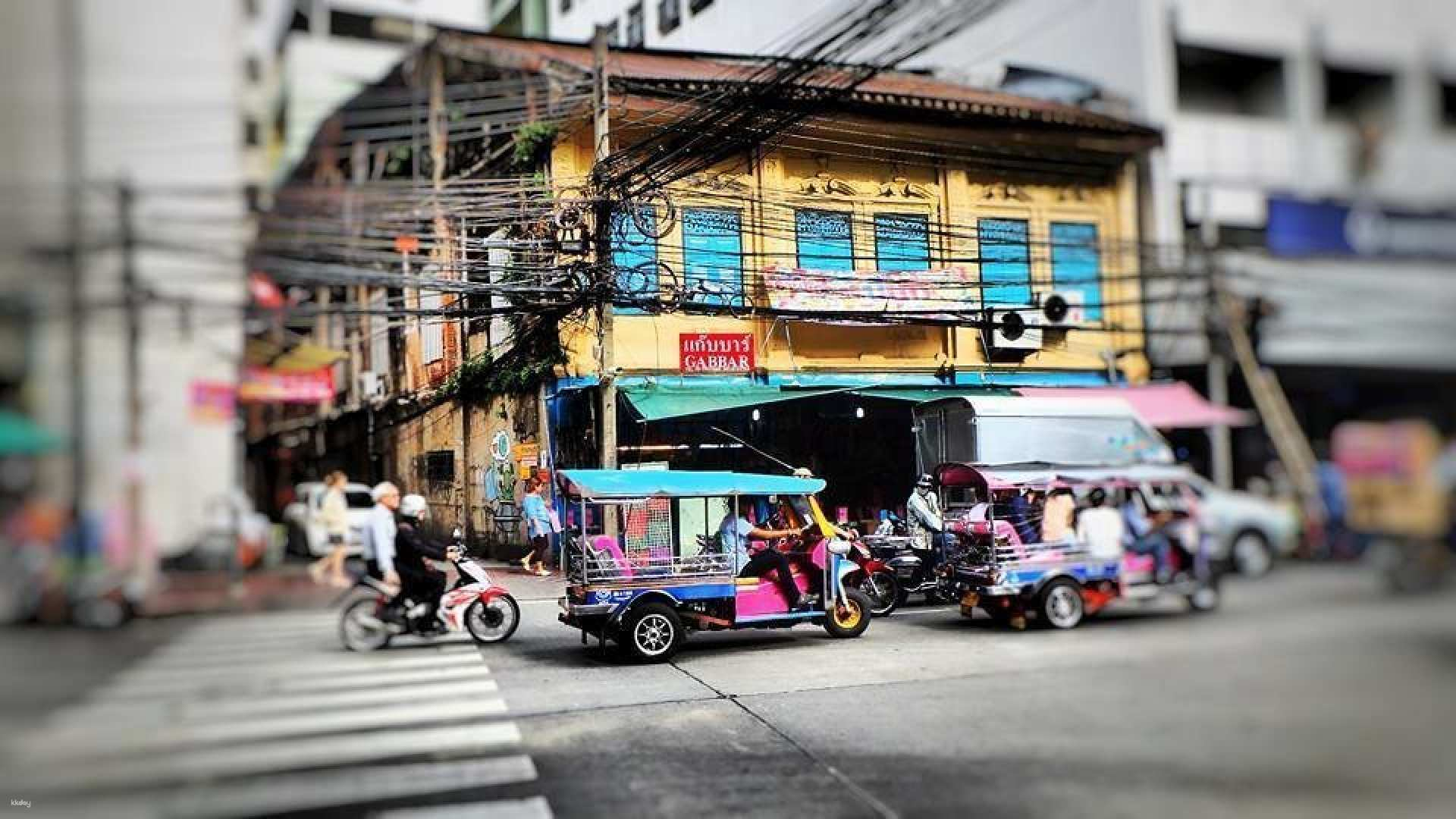 Explore Bangkok's bustling streets from the unique comfort of a tuk-tuk soaking in the sights and sounds while visiting iconic landmarks like the Grand Palace and Wat Pho.