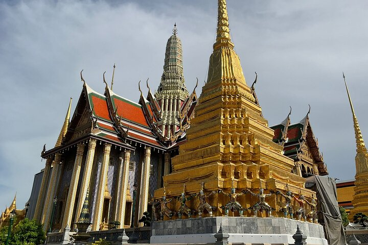 Discover the intricate details and stunning architecture of Bangkok's royal temples where every corner reveals Thailand's rich history and spiritual essence perfect for an unforgettable walking tour.