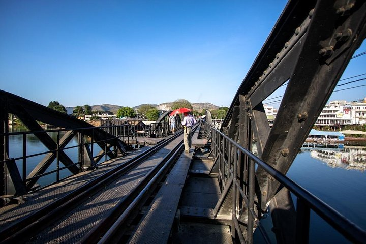 Discover the rich history and stunning scenery of Kanchanaburi while walking along the iconic bridge where tales of resilience meet breathtaking views—a must-see for every traveler.
